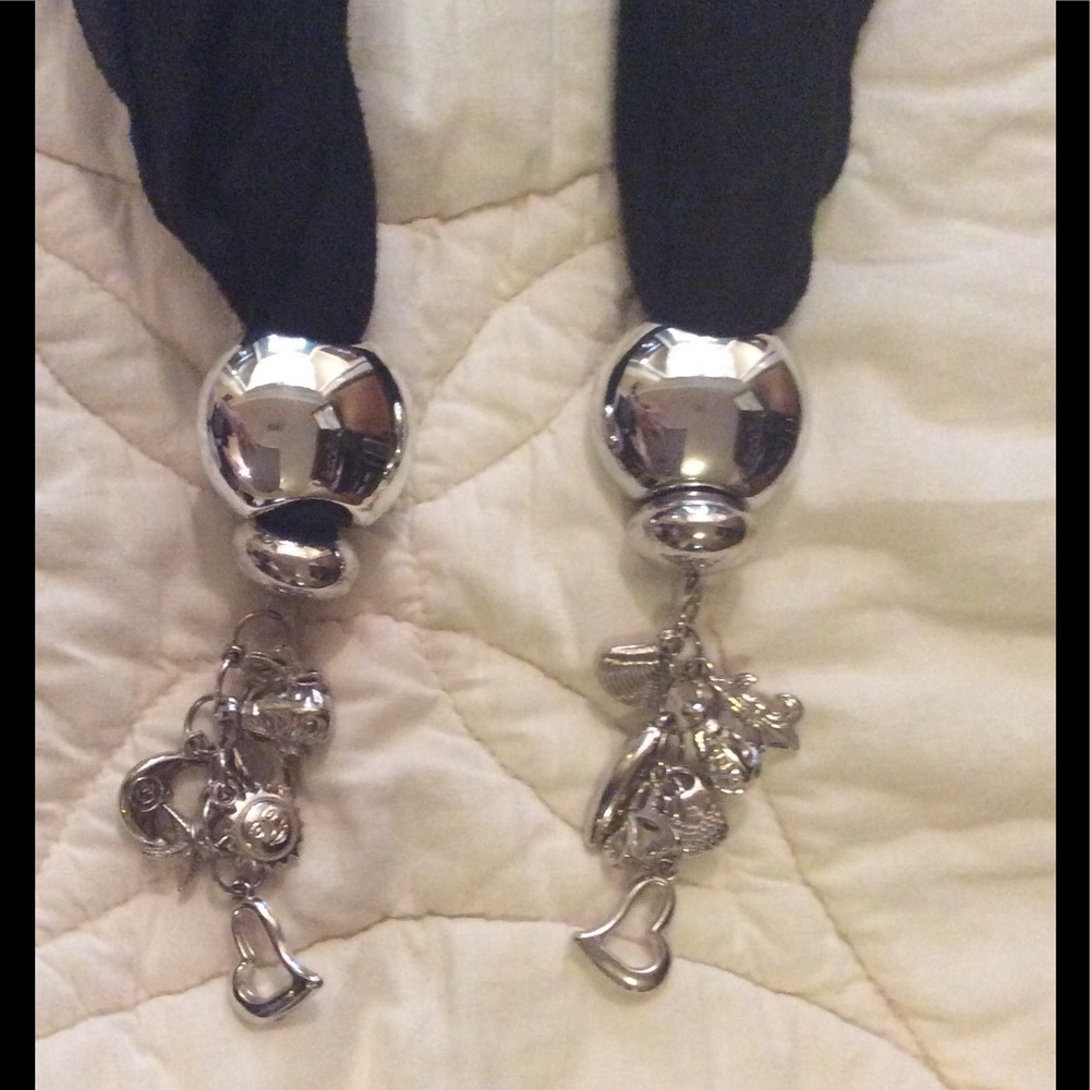 Scarf with silver tone charms.